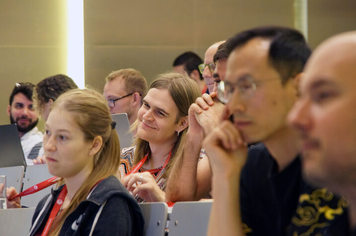 Participants in the lecture hall, listening.
